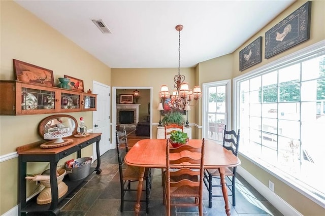 12 Blackfoot Trl, Sharpsburg, GA 30277 - dining room with plenty of natural light, a chandelier, and baseboards