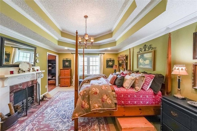 12 Blackfoot Trl, Sharpsburg, GA 30277 - bedroom featuring multiple windows, crown molding, a raised ceiling, a chandelier, and a fireplace with flush hearth