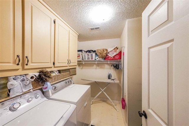 12 Blackfoot Trl, Sharpsburg, GA 30277 - laundry area with washing machine and clothes dryer, cabinet space, and a textured ceiling