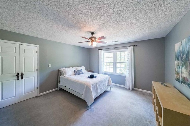 12 Blackfoot Trl, Sharpsburg, GA 30277 - bedroom featuring light colored carpet, a ceiling fan, baseboards, and a textured ceiling