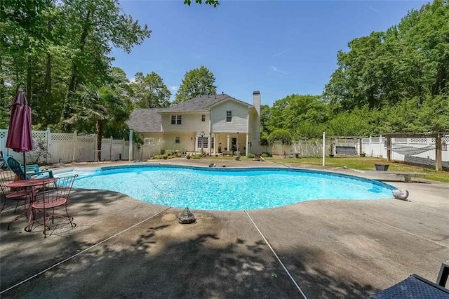 12 Blackfoot Trl, Sharpsburg, GA 30277 - view of swimming pool with a patio and a fenced backyard