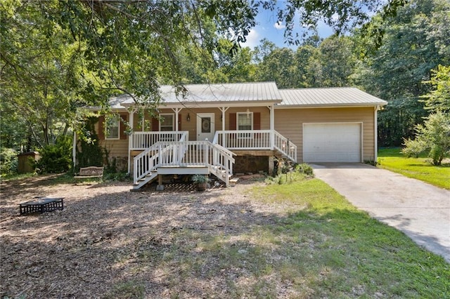 136 Pine St, Covington, GA 30014 - single story home featuring a porch, a garage, concrete driveway, and stairway