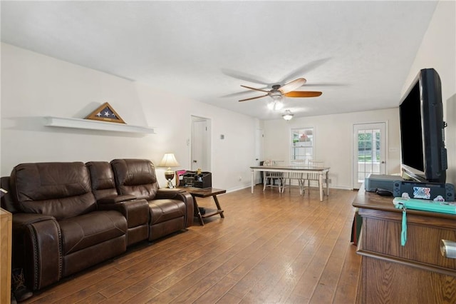 136 Pine St, Covington, GA 30014 - living room with a ceiling fan and wood finished floors