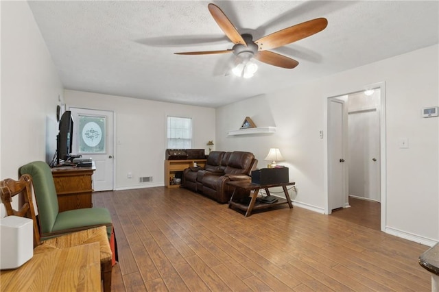 136 Pine St, Covington, GA 30014 - living area featuring a ceiling fan and wood-type flooring