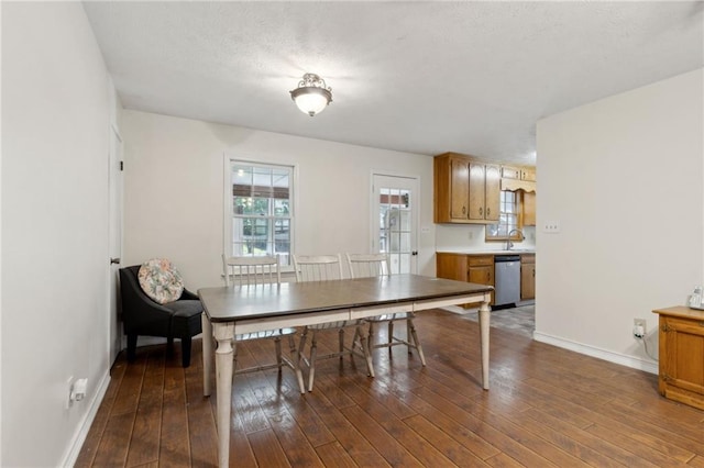 136 Pine St, Covington, GA 30014 - dining space featuring baseboards and dark wood-style floors