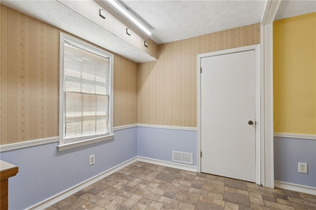 136 Pine St, Covington, GA 30014 - unfurnished room featuring stone finish flooring and baseboards