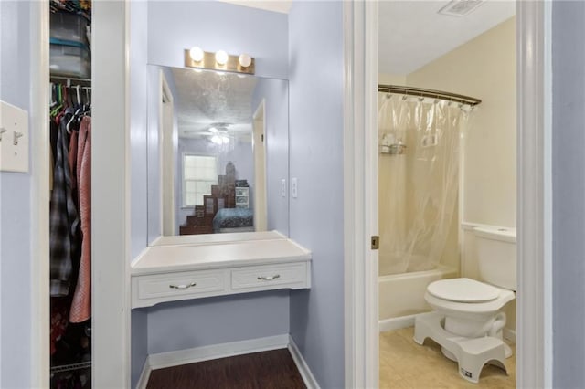 136 Pine St, Covington, GA 30014 - full bathroom featuring shower / bathtub combination with curtain and toilet