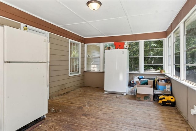 136 Pine St, Covington, GA 30014 - sunroom with wood finished floors and a wooden deck