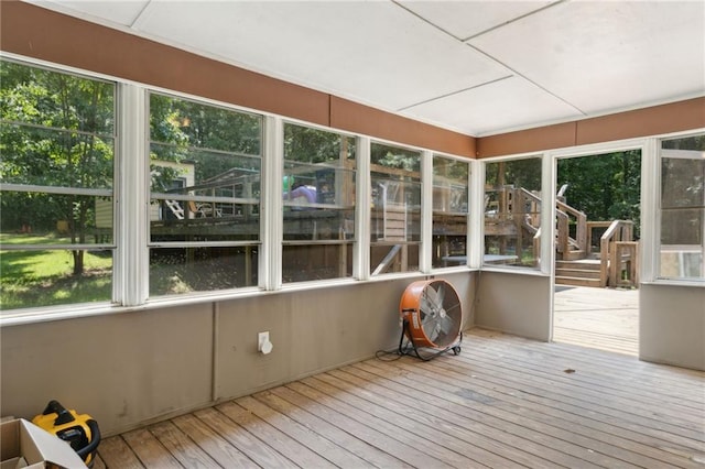 136 Pine St, Covington, GA 30014 - unfurnished sunroom with hardwood / wood-style floors, plenty of natural light, and a wooden deck