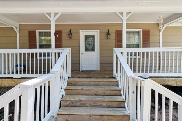136 Pine St, Covington, GA 30014 - view of exterior entry featuring covered porch
