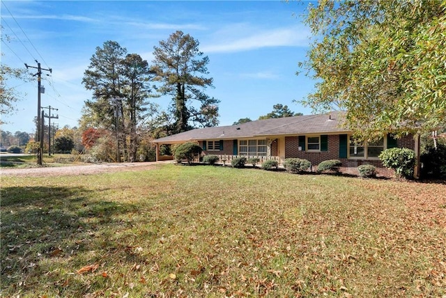 ranch-style home featuring a front yard