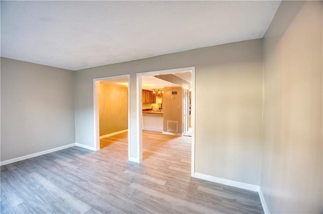 unfurnished room featuring light hardwood / wood-style floors