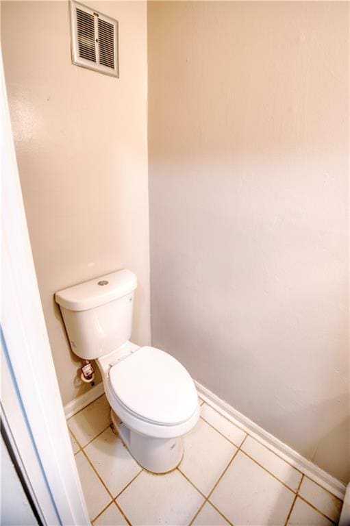 bathroom with tile patterned floors and toilet