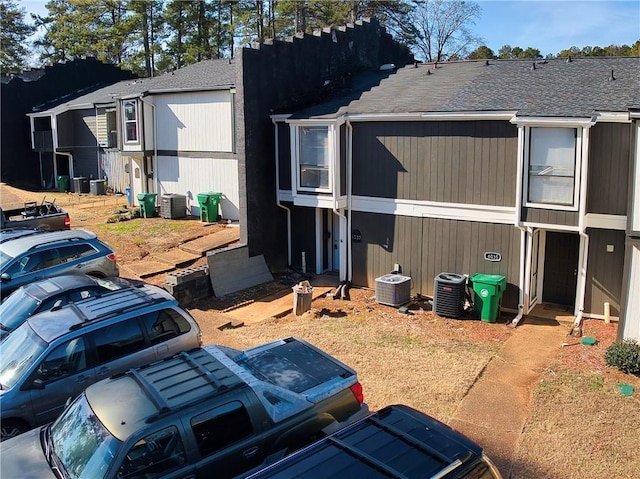 view of side of property featuring central air condition unit