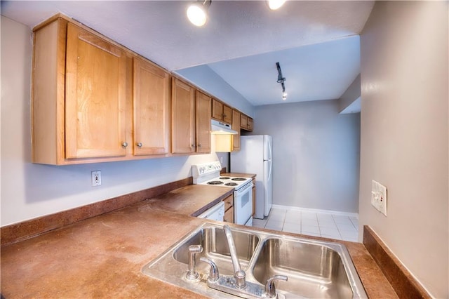 kitchen featuring sink, white appliances, and rail lighting