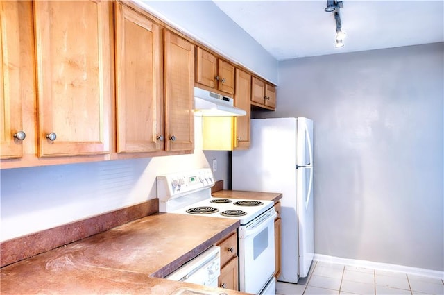 kitchen featuring track lighting and white appliances