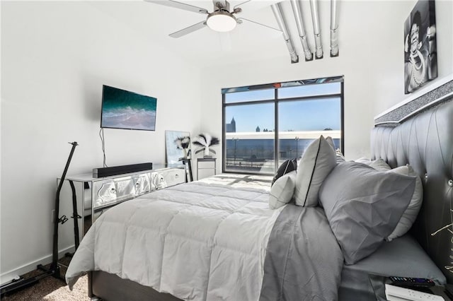 bedroom featuring ceiling fan, access to exterior, and carpet floors