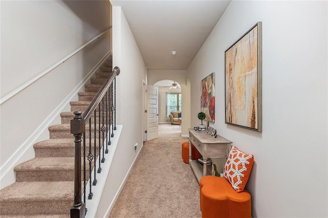 2149 Apple Orchard Way, Austell, GA 30168 - hall featuring carpet floors, stairway, arched walkways, and baseboards