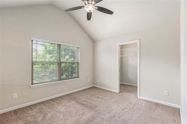 2149 Apple Orchard Way, Austell, GA 30168 - unfurnished bedroom with lofted ceiling, carpet flooring, a walk in closet, baseboards, and ceiling fan