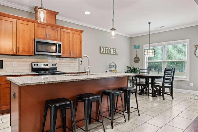 35 Huntington Way, Williamson, GA 30292 - kitchen featuring brown cabinetry, a sink, backsplash, and stainless steel appliances