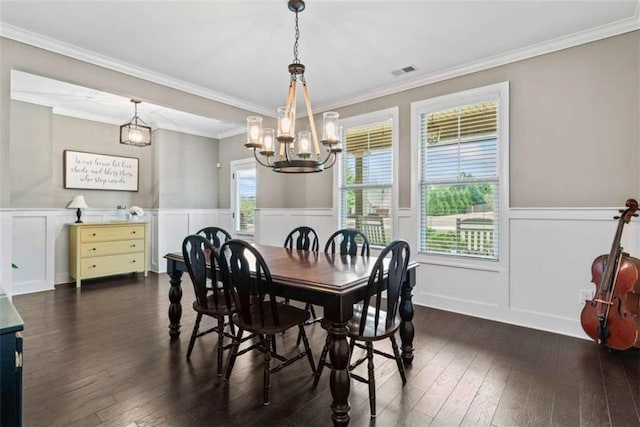 35 Huntington Way, Williamson, GA 30292 - dining area with an inviting chandelier, a decorative wall, crown molding, and dark wood-style floors