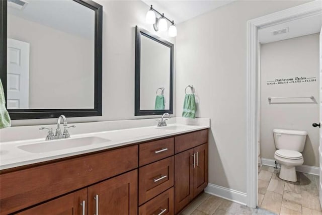 35 Huntington Way, Williamson, GA 30292 - bathroom featuring baseboards, visible vents, and a sink