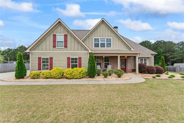 35 Huntington Way, Williamson, GA 30292 - view of front of house with a chimney, fence, board and batten siding, and a front lawn