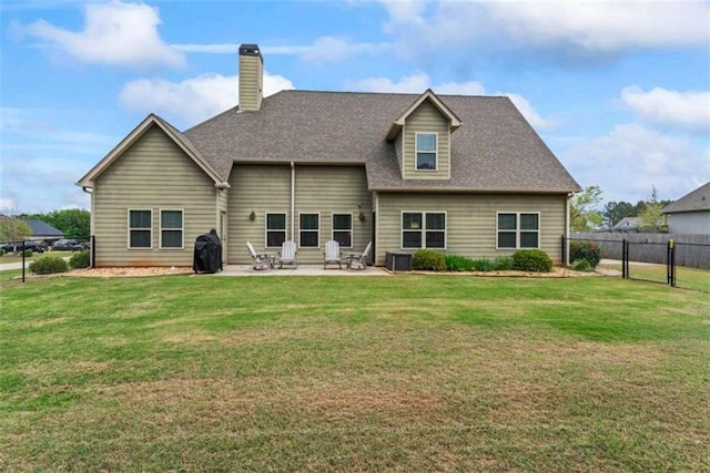 35 Huntington Way, Williamson, GA 30292 - back of property with a patio, fence, a chimney, and a lawn