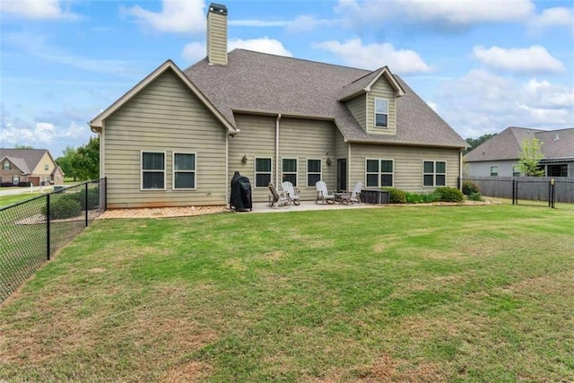 35 Huntington Way, Williamson, GA 30292 - rear view of property featuring a lawn, a patio, a fenced backyard, and a chimney
