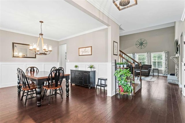 35 Huntington Way, Williamson, GA 30292 - dining space featuring hardwood / wood-style flooring, crown molding, stairway, an inviting chandelier, and wainscoting