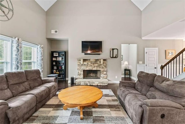 35 Huntington Way, Williamson, GA 30292 - living room featuring a fireplace, stairs, high vaulted ceiling, and visible vents