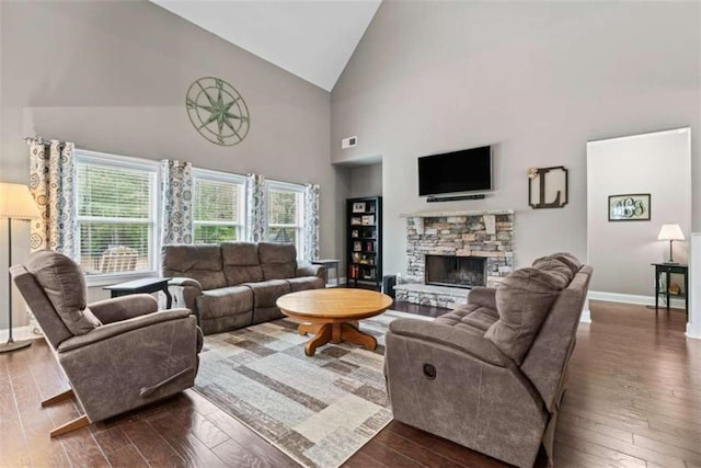 35 Huntington Way, Williamson, GA 30292 - living area featuring high vaulted ceiling, baseboards, dark wood-style flooring, and a fireplace