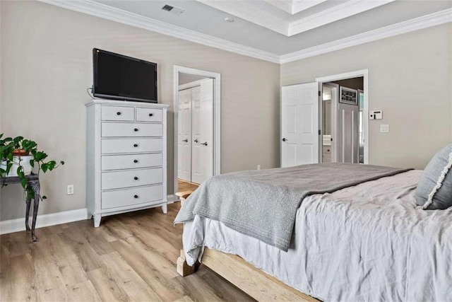 bedroom featuring light hardwood / wood-style floors and ornamental molding