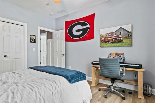 bedroom with a closet and light wood-type flooring