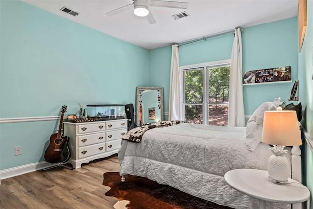 bedroom with light wood-type flooring and ceiling fan