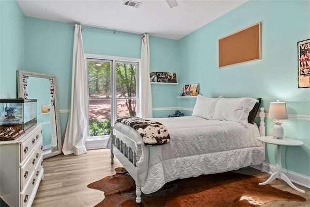 bedroom featuring light wood-type flooring and ceiling fan