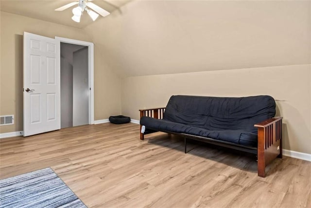 interior space with ceiling fan, light hardwood / wood-style flooring, and lofted ceiling