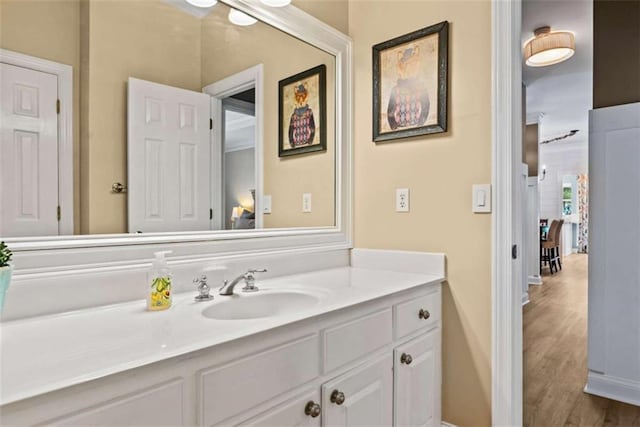 bathroom with vanity and hardwood / wood-style flooring