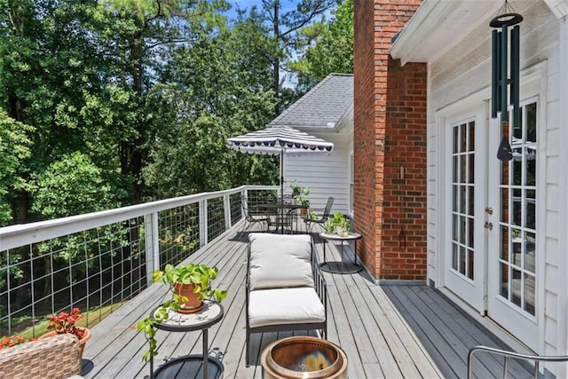 wooden terrace featuring french doors