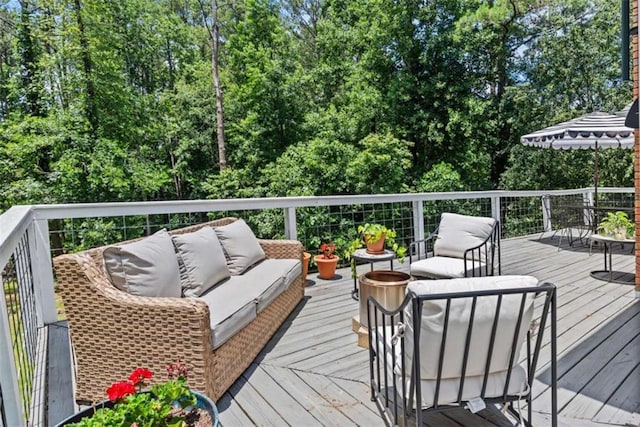 wooden terrace featuring an outdoor hangout area