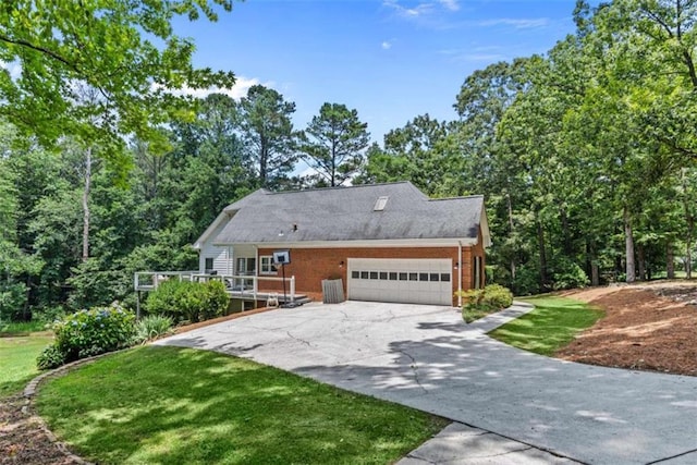 view of front of property with a garage and a front lawn