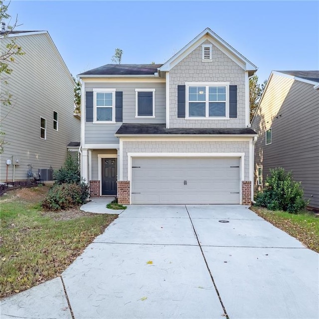 view of front of home featuring central AC unit and a garage