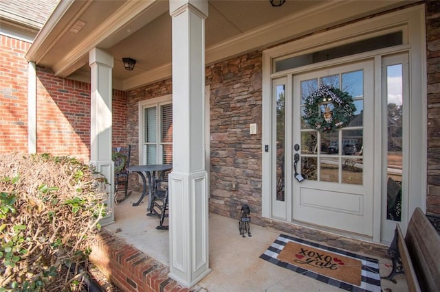 entrance to property featuring a porch