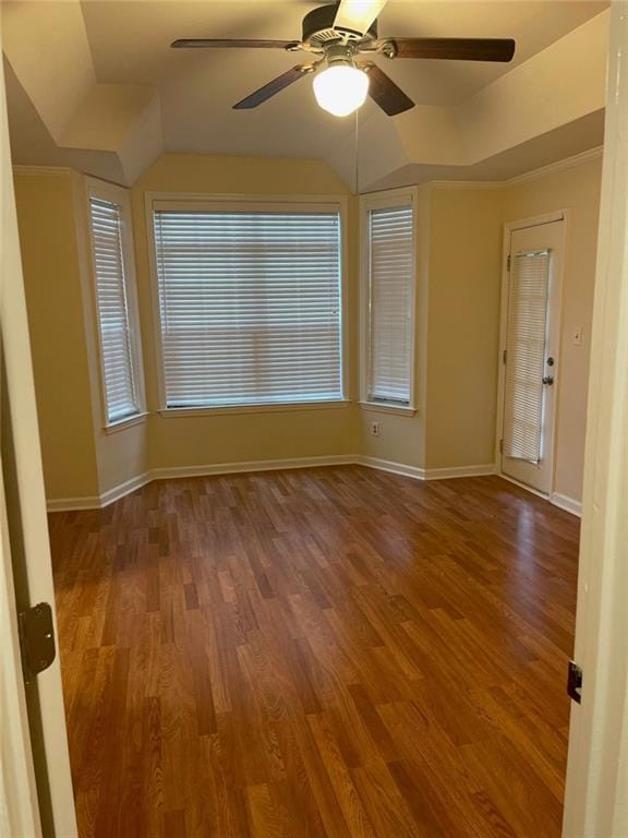 unfurnished room with crown molding, ceiling fan, and wood-type flooring