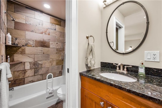 bathroom with toilet, tub / shower combination, and vanity