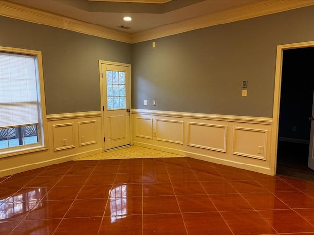 unfurnished room featuring tile patterned floors and crown molding