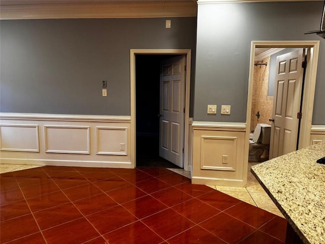 bathroom featuring tile patterned floors and ornamental molding