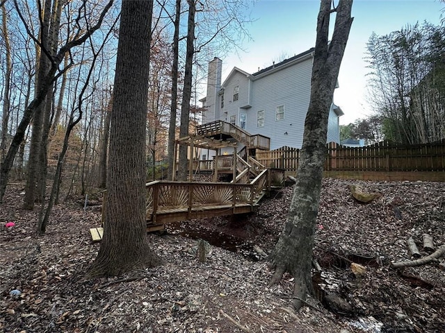 view of side of home with a wooden deck