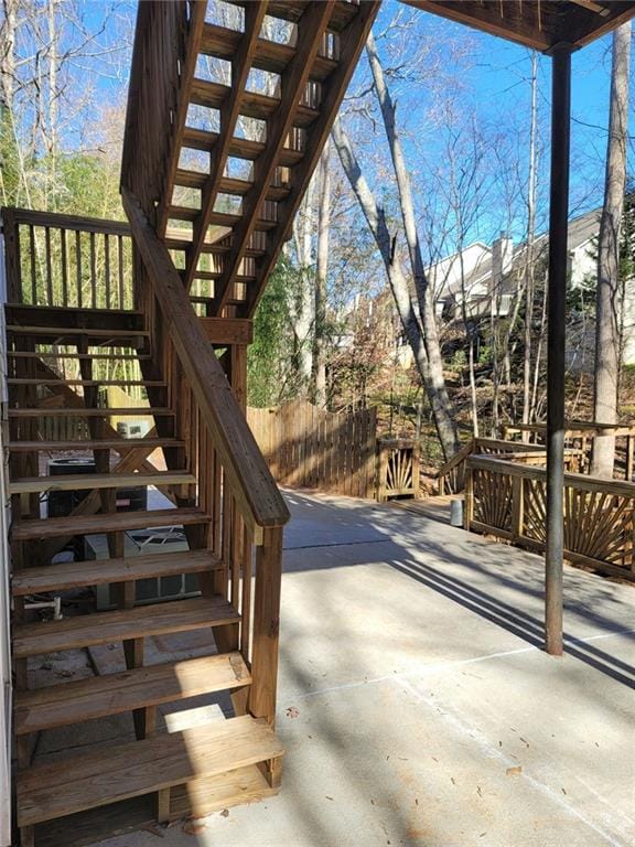 wooden terrace featuring a patio