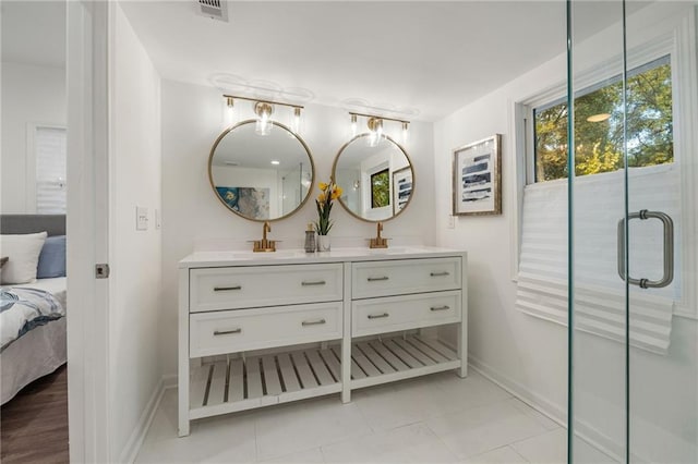 full bathroom featuring a sink, double vanity, connected bathroom, and visible vents